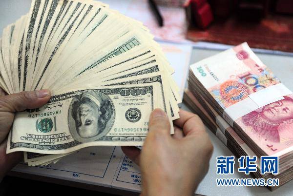Yuan pranë barazimit me dollarin